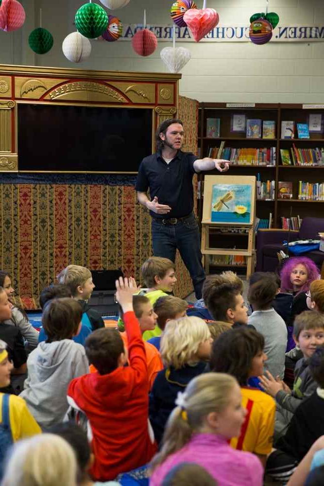 Yancey presents a puppet show to students at Ada Vista Elementary School.